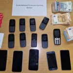 Bani și telefoane confiscate de Garda