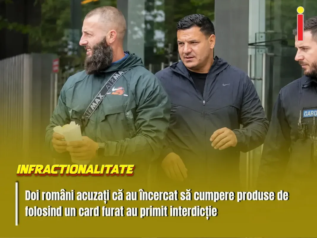 Doi români acuzați că au folosit un card bancar furat
